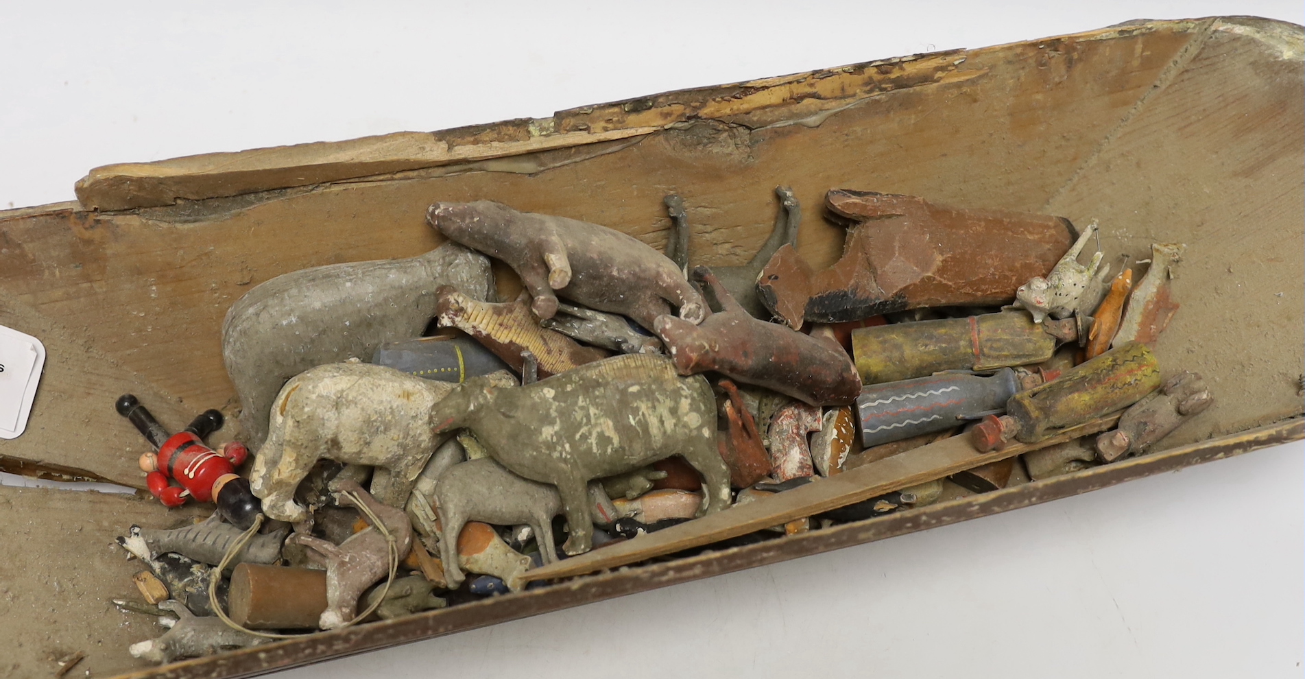 A mid 19th century Swiss or German Noah's Ark for restoration (incomplete), containing a selection of carved wooden animals, 69cm long, 32cm high